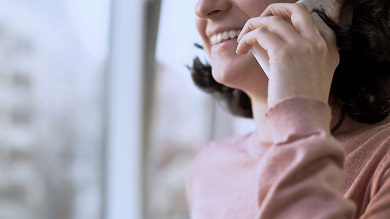 Educator, smiling, Holding a phone to their ear
